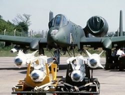 A front view of an A-10 Thunderbolt II aircraft being uploaded with AGM-65 Maverick missiles.