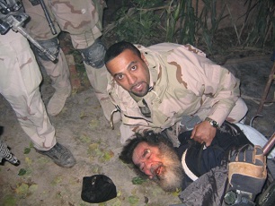 Saddam bersembunyi di lubang